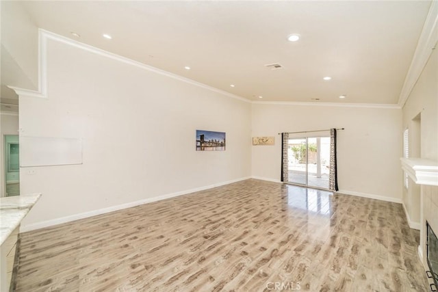 7404 Marshall Ct, Highland, CA 92346 - unfurnished living room with light wood-style floors, crown molding, baseboards, recessed lighting, and lofted ceiling