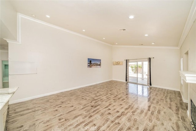 7404 Marshall Ct, Highland, CA 92346 - unfurnished living room featuring light wood finished floors, crown molding, and recessed lighting
