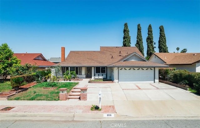 1616 Orchard Hill Ln, Hacienda Heights, CA 91745 - single story home featuring a garage, covered porch, driveway, and a chimney