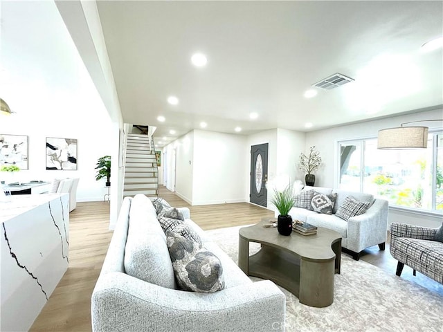 1616 Orchard Hill Ln, Hacienda Heights, CA 91745 - living room featuring recessed lighting, stairway, light wood-style flooring, and baseboards