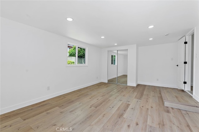 19617 Enslow Dr, Carson, CA 90746 - unfurnished bedroom featuring light wood-type flooring, recessed lighting, baseboards, and a closet