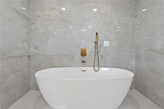 19617 Enslow Dr, Carson, CA 90746 - full bath featuring tile walls, a freestanding bath, and tile patterned flooring