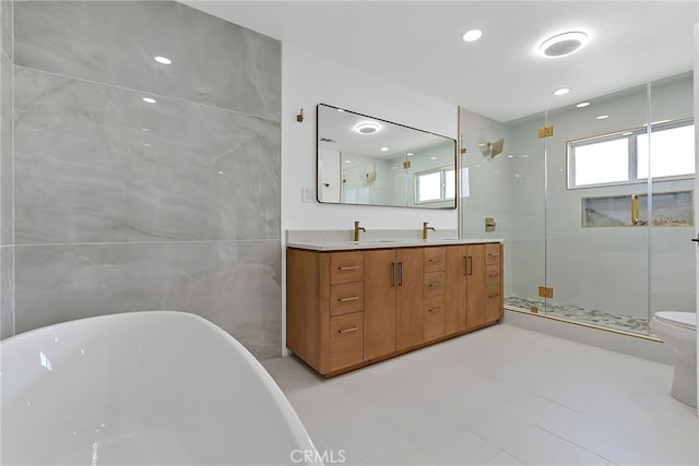 19617 Enslow Dr, Carson, CA 90746 - full bath featuring a shower stall, double vanity, a freestanding tub, and toilet