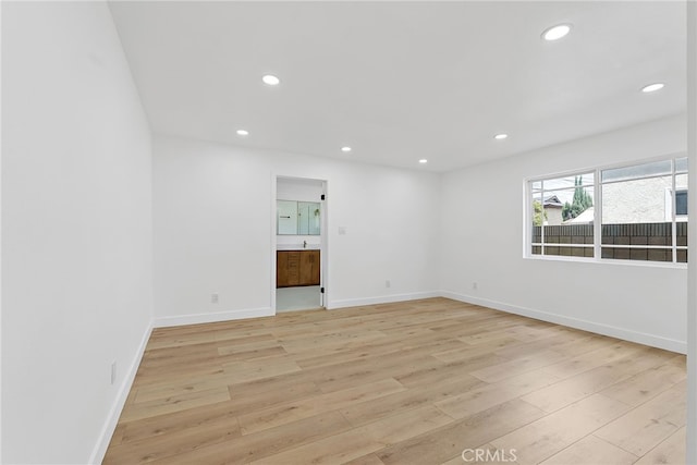 19617 Enslow Dr, Carson, CA 90746 - unfurnished room with light wood-type flooring, recessed lighting, and baseboards