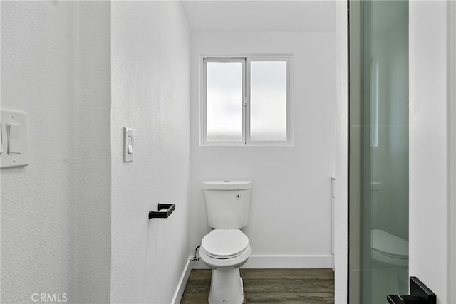 19617 Enslow Dr, Carson, CA 90746 - bathroom with toilet, baseboards, and wood finished floors