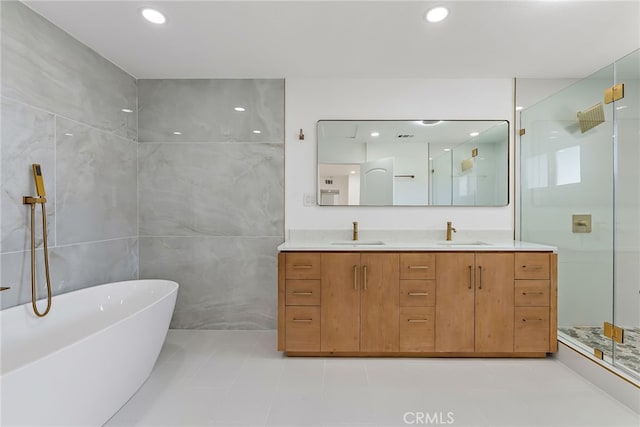 19617 Enslow Dr, Carson, CA 90746 - full bath with a walk in shower, double vanity, a soaking tub, recessed lighting, and tile patterned floors