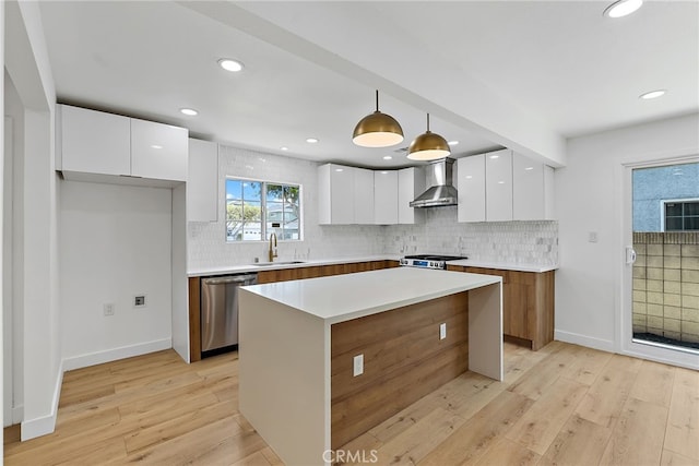 19617 Enslow Dr, Carson, CA 90746 - kitchen featuring dishwasher, modern cabinets, a sink, wall chimney exhaust hood, and white cabinetry