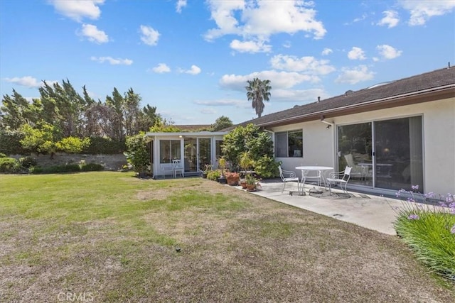2015 E Hillman Cir, Orange, CA 92867 - back of house featuring stucco siding, a patio area, a sunroom, and a yard