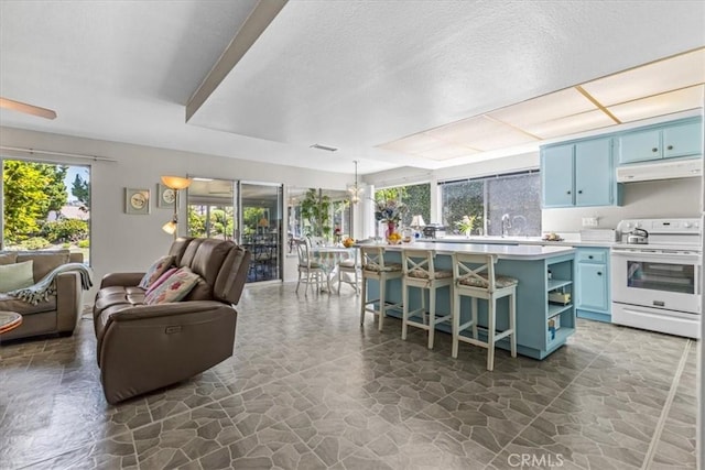 2015 E Hillman Cir, Orange, CA 92867 - living area featuring stone floors and a textured ceiling