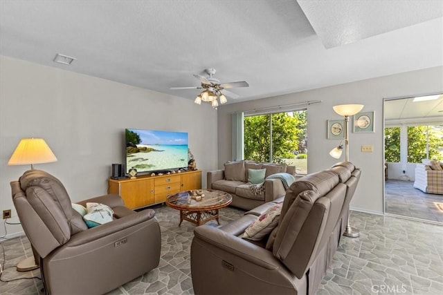 2015 E Hillman Cir, Orange, CA 92867 - living area with ceiling fan, light stone finish floors, a textured ceiling, and baseboards