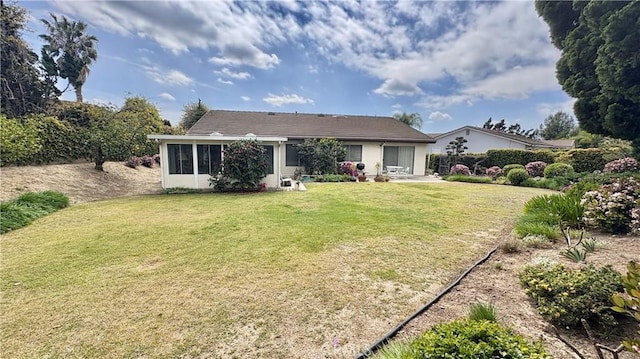 2015 E Hillman Cir, Orange, CA 92867 - rear view of property with a lawn and a patio area
