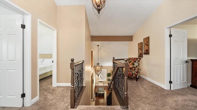13819 Dogwood Ave, Chino, CA 91710 - hallway with carpet flooring, an upstairs landing, baseboards, and lofted ceiling