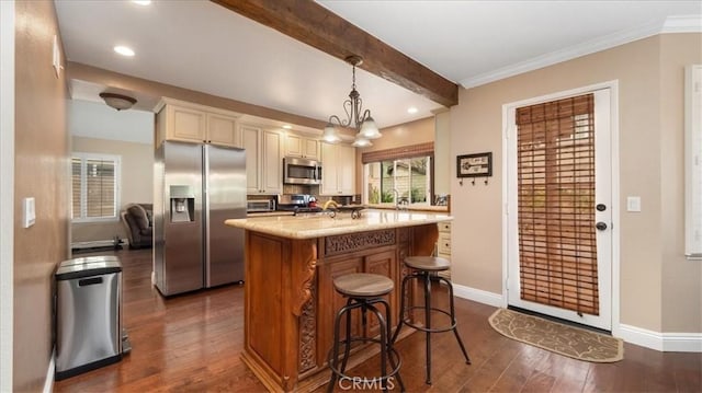13819 Dogwood Ave, Chino, CA 91710 - kitchen with stainless steel appliances, dark wood-style floors, baseboards, beam ceiling, and cream cabinetry
