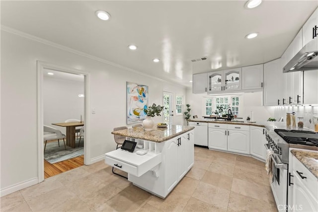 4428 Saugus Ave, Sherman Oaks, CA 91403 - kitchen with high end stainless steel range oven, ornamental molding, wall chimney range hood, recessed lighting, and a sink