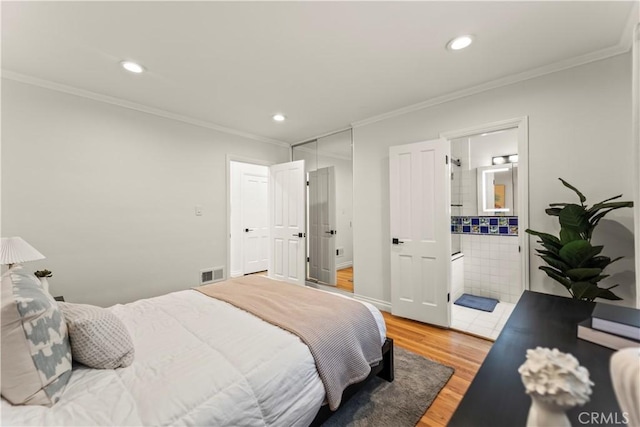 4428 Saugus Ave, Sherman Oaks, CA 91403 - bedroom featuring light wood-style flooring, crown molding, recessed lighting, ensuite bathroom, and baseboards