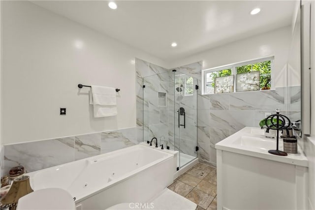 4428 Saugus Ave, Sherman Oaks, CA 91403 - bathroom featuring recessed lighting, a marble finish shower, tile walls, a tub with jets, and vanity
