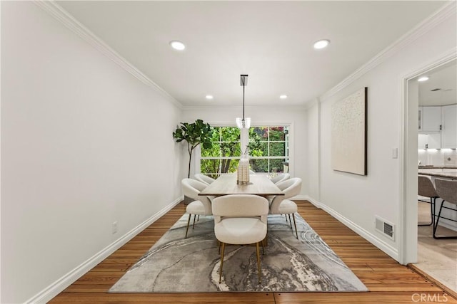 4428 Saugus Ave, Sherman Oaks, CA 91403 - dining area with recessed lighting, baseboards, ornamental molding, and light wood-style floors