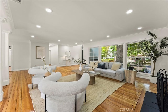 4428 Saugus Ave, Sherman Oaks, CA 91403 - living area featuring ornamental molding, light wood finished floors, recessed lighting, and baseboards