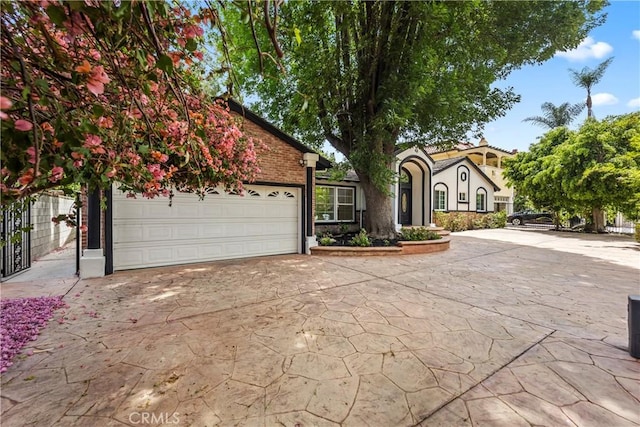 4428 Saugus Ave, Sherman Oaks, CA 91403 - view of front facade featuring driveway and an attached garage