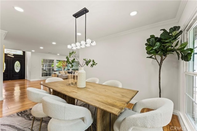 4428 Saugus Ave, Sherman Oaks, CA 91403 - dining area featuring ornamental molding, recessed lighting, wood finished floors, and baseboards