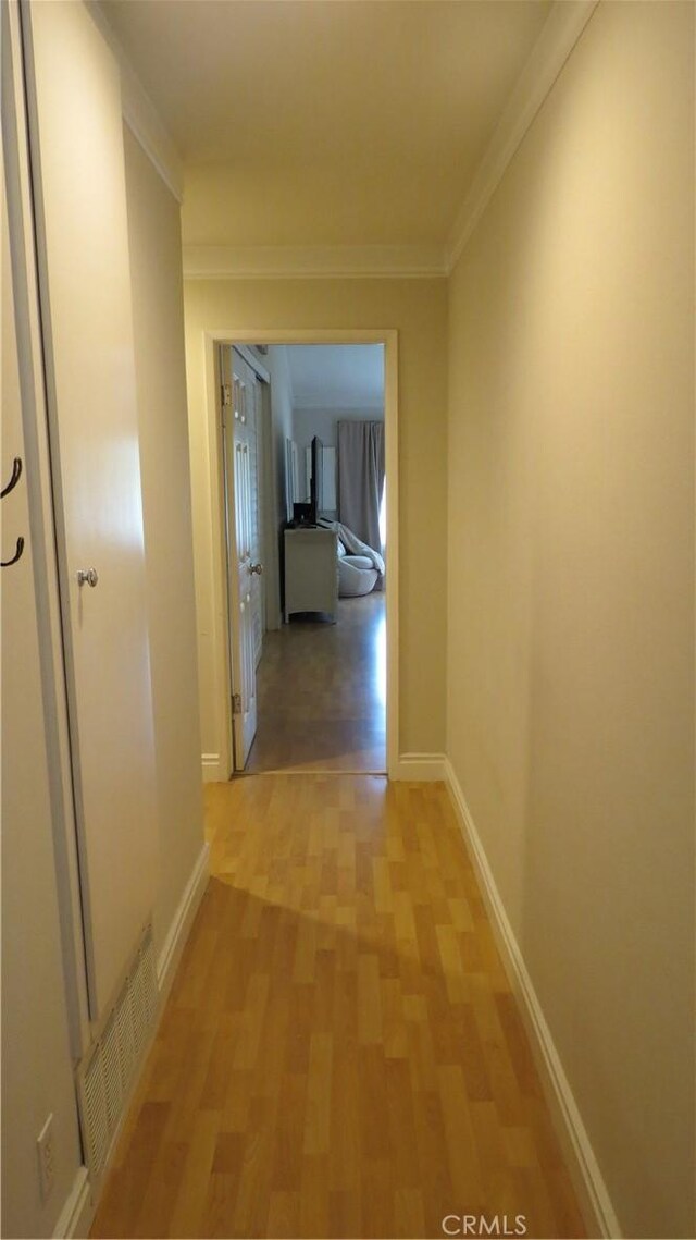 306 Vista Trucha, Newport Beach, CA 92660 - corridor with light wood-style flooring, baseboards, and ornamental molding