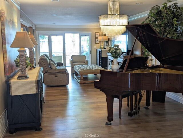 306 Vista Trucha, Newport Beach, CA 92660 - sitting room with wood-type flooring, a chandelier, and ornamental molding