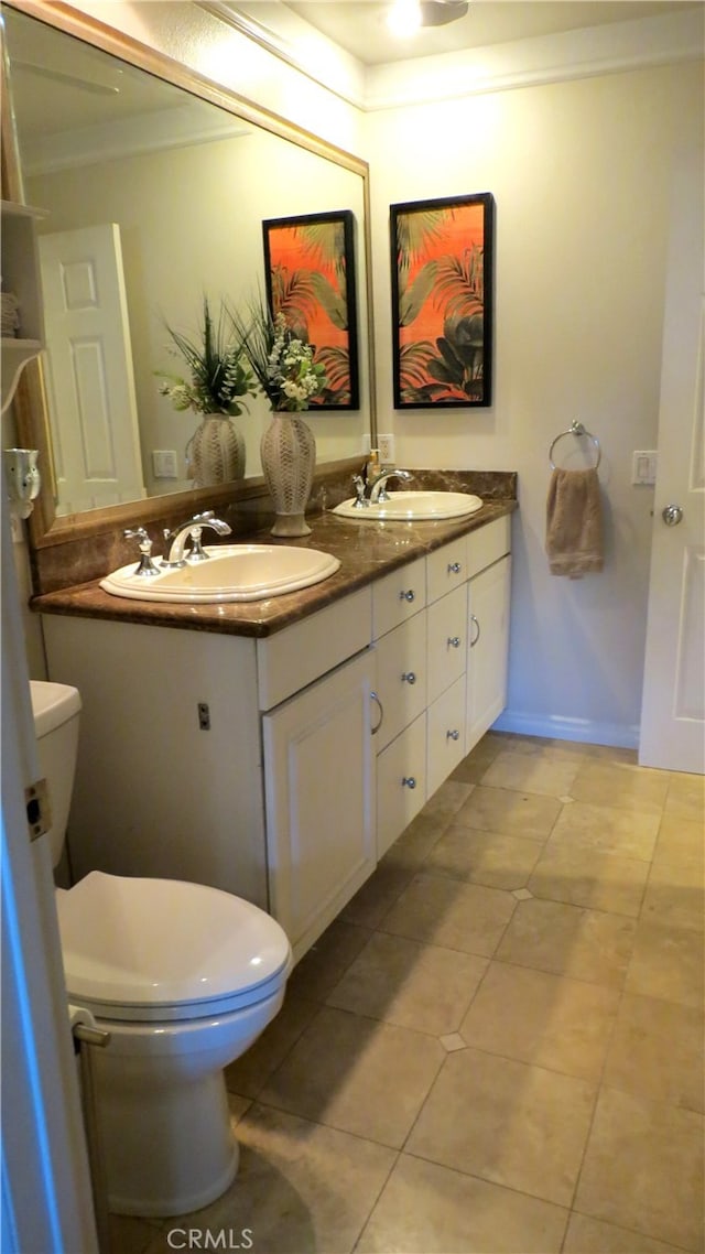 306 Vista Trucha, Newport Beach, CA 92660 - bathroom featuring crown molding, toilet, tile patterned flooring, and double vanity