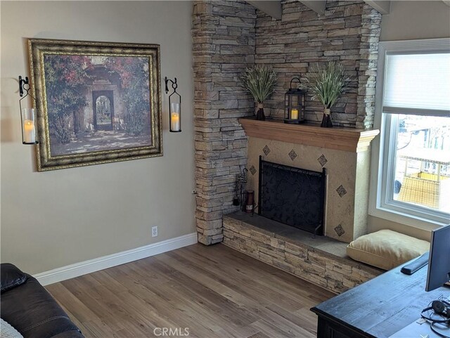 306 Vista Trucha, Newport Beach, CA 92660 - living area with wood finished floors, baseboards, and a fireplace with raised hearth