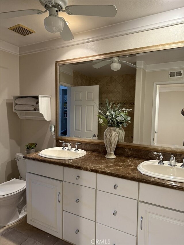 306 Vista Trucha, Newport Beach, CA 92660 - full bathroom featuring a ceiling fan, ornamental molding, toilet, tile patterned flooring, and double vanity