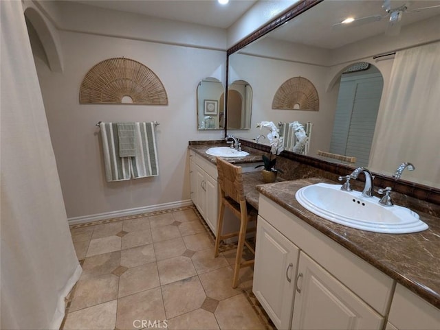 306 Vista Trucha, Newport Beach, CA 92660 - bathroom featuring double vanity, tile patterned floors, baseboards, and recessed lighting
