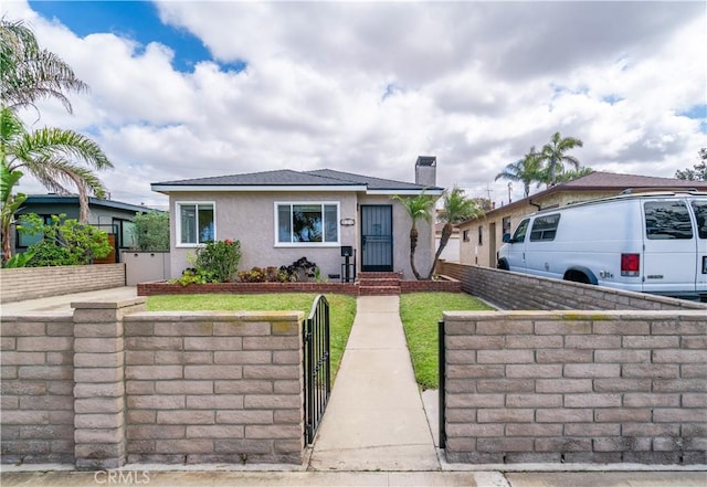 524 N Paulina Ave, Redondo Beach, CA 90277 - bungalow featuring stucco siding, a gate, and a chimney