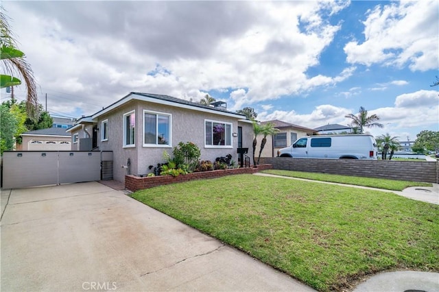 524 N Paulina Ave, Redondo Beach, CA 90277 - view of front of home featuring stucco siding, concrete driveway, and a front yard