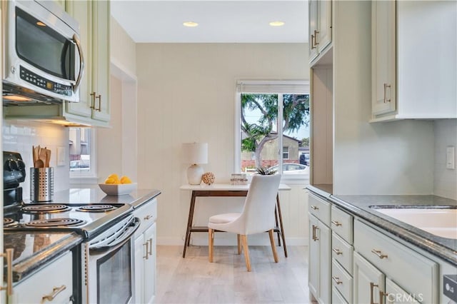 524 N Paulina Ave, Redondo Beach, CA 90277 - kitchen with stainless steel microwave, electric range oven, dark stone countertops, and recessed lighting
