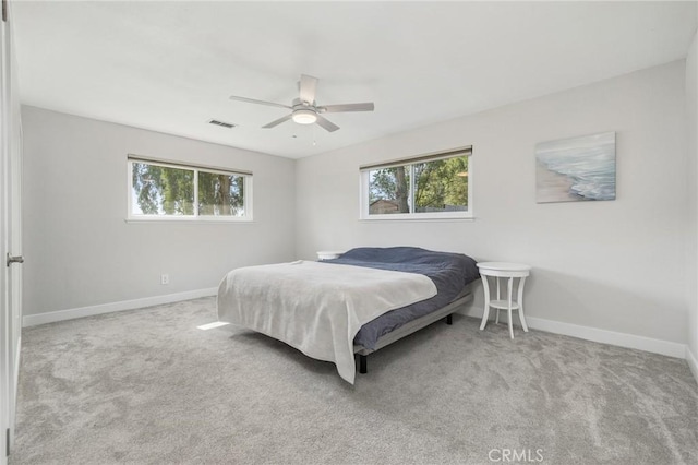 8151 Chamise Ave, Clovis, CA 93619 - carpeted bedroom featuring multiple windows, baseboards, and ceiling fan