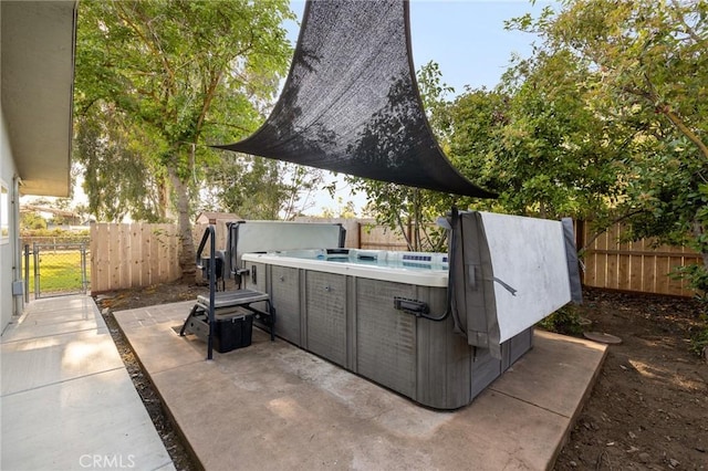8151 Chamise Ave, Clovis, CA 93619 - view of patio with a fenced backyard, a hot tub, and a gate