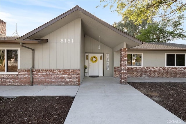 8151 Chamise Ave, Clovis, CA 93619 - property entrance with brick siding and roof with shingles