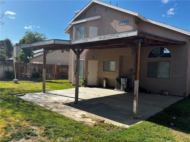 2644 Mora Ct, Lancaster, CA 93535 - rear view of house featuring stucco siding, central AC, and a patio area