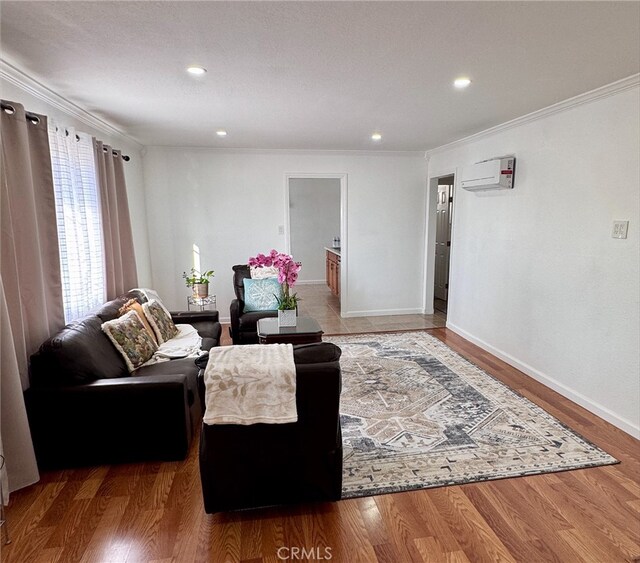640 Flora St, Barstow, CA 92311 - living room featuring ornamental molding, baseboards, recessed lighting, a wall unit AC, and wood finished floors