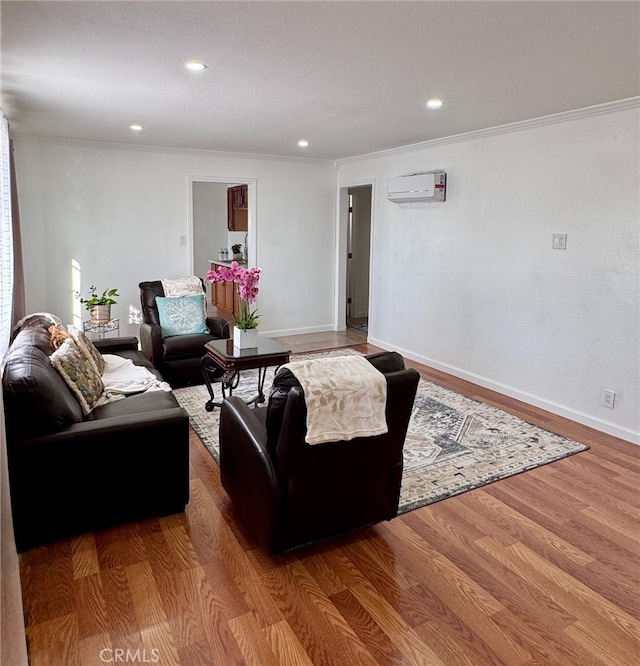 640 Flora St, Barstow, CA 92311 - living area featuring a wall mounted air conditioner, crown molding, baseboards, wood finished floors, and recessed lighting