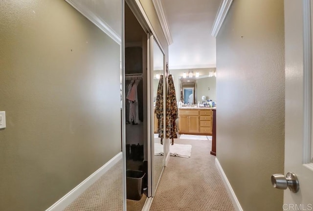 475 Marsh Harbor Dr, San Diego, CA 92154 - hallway with crown molding, light carpet, and baseboards