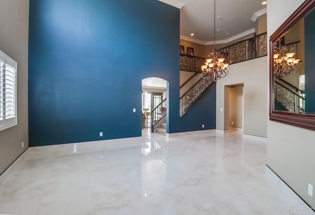 475 Marsh Harbor Dr, San Diego, CA 92154 - unfurnished room with a chandelier, a high ceiling, stairway, crown molding, and arched walkways