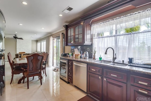 475 Marsh Harbor Dr, San Diego, CA 92154 - kitchen with stainless steel dishwasher, a sink, a ceiling fan, dark stone countertops, and light tile patterned flooring