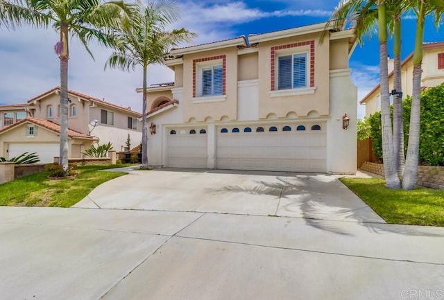475 Marsh Harbor Dr, San Diego, CA 92154 - mediterranean / spanish-style home featuring an attached garage, concrete driveway, and stucco siding