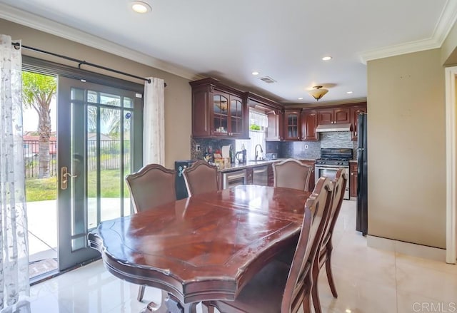 475 Marsh Harbor Dr, San Diego, CA 92154 - dining room with ornamental molding, light tile patterned floors, and recessed lighting