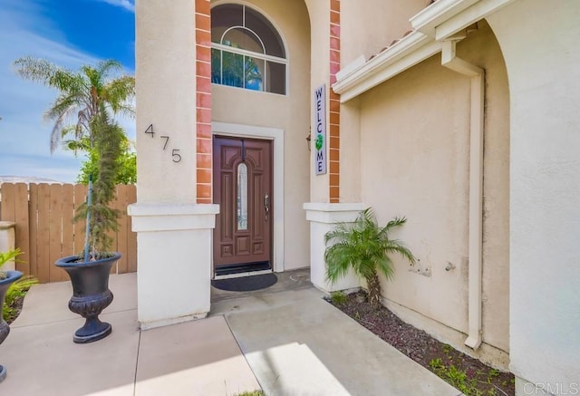 475 Marsh Harbor Dr, San Diego, CA 92154 - view of exterior entry featuring stucco siding and fence
