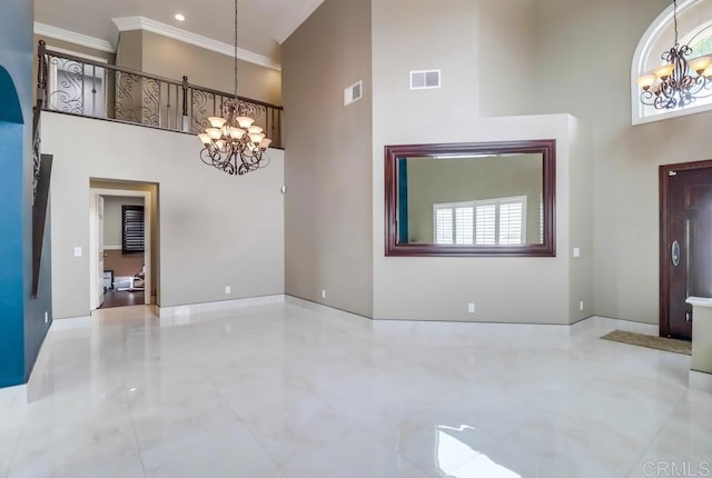 475 Marsh Harbor Dr, San Diego, CA 92154 - entrance foyer featuring a chandelier, a towering ceiling, crown molding, and baseboards