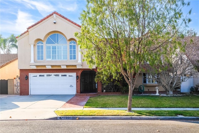 10351 Lassen St, Los Alamitos, CA 90720 - view of front of home with concrete driveway, an attached garage, a front lawn, and brick siding