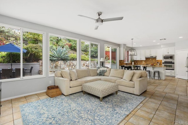 6628 Sitio Sago, Carlsbad, CA 92011 - living room featuring light tile patterned floors, healthy amount of natural light, a ceiling fan, recessed lighting, and baseboards