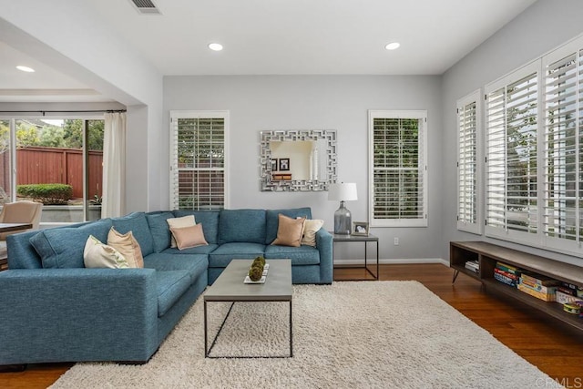 6628 Sitio Sago, Carlsbad, CA 92011 - living area featuring wood finished floors, recessed lighting, and baseboards