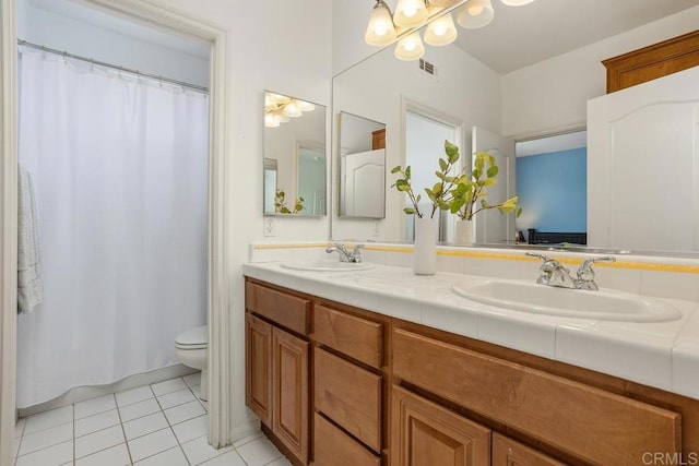 6628 Sitio Sago, Carlsbad, CA 92011 - full bath featuring tile patterned flooring, toilet, double vanity, a chandelier, and a shower with shower curtain